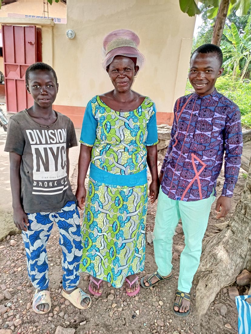 Afi-w-sons-TOGO-2022-June Togolese woman, Afi, with two of her sons.