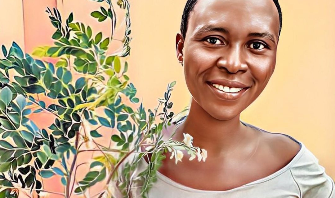 Togolese woman holding moringa branches